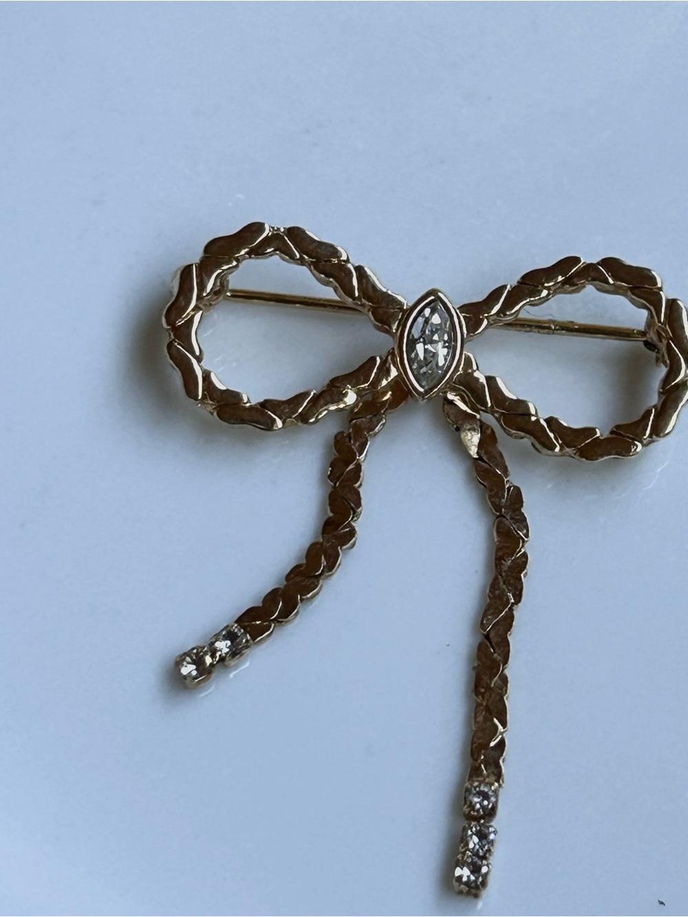 Vintage Avon 1985 Gold Dangling Bow Brooch with Clear Crystal Rhinestones pin